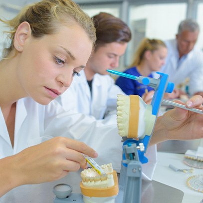 Dental technicians making dentures