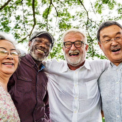 Patient in Garland smiling with dentures